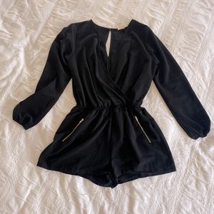 Black long sleeve v-neck romper with zipper pockets
